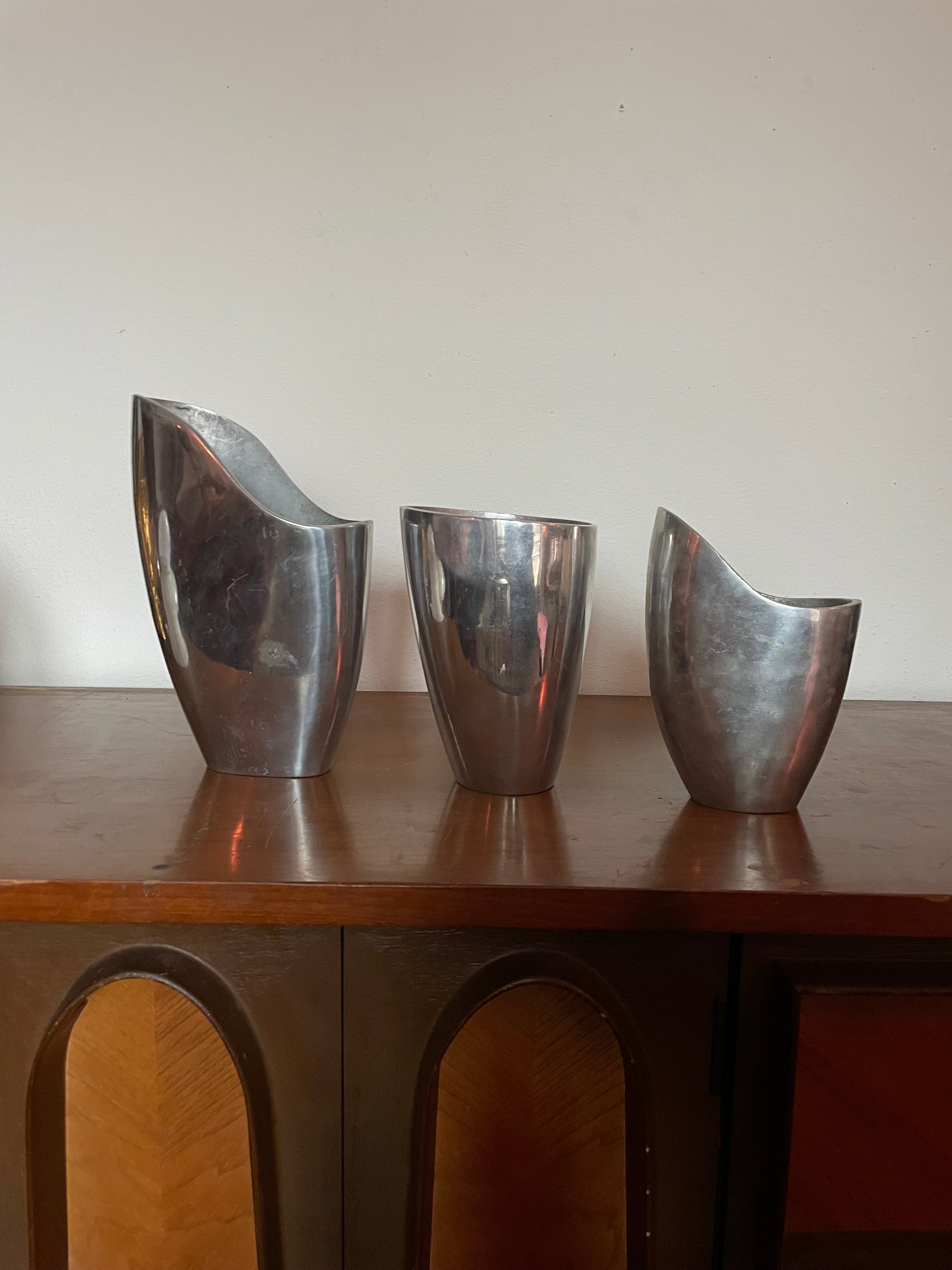 three aluminum vessels