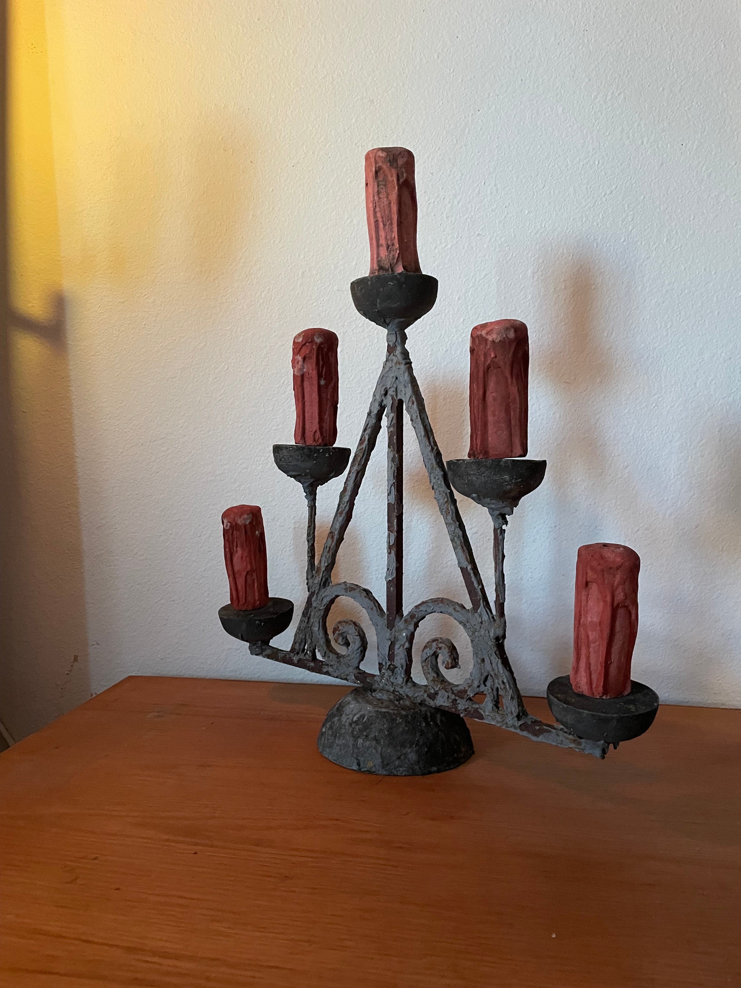 really weird but cool candelabra with five candle figures