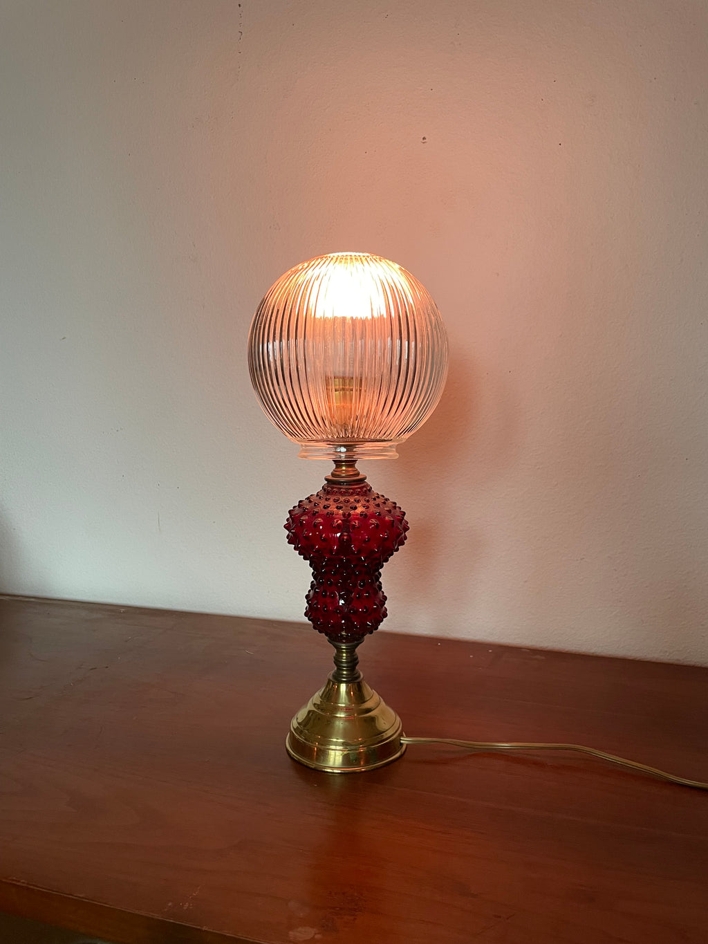 ruby glass and gold table lamp