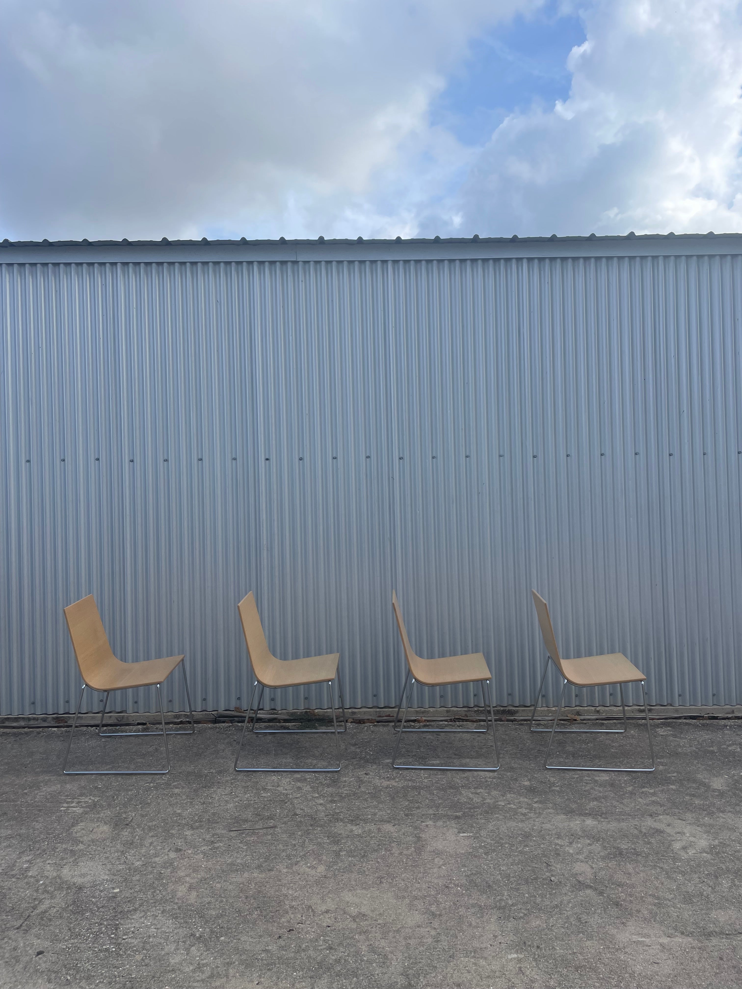 four dining chairs by andreu world