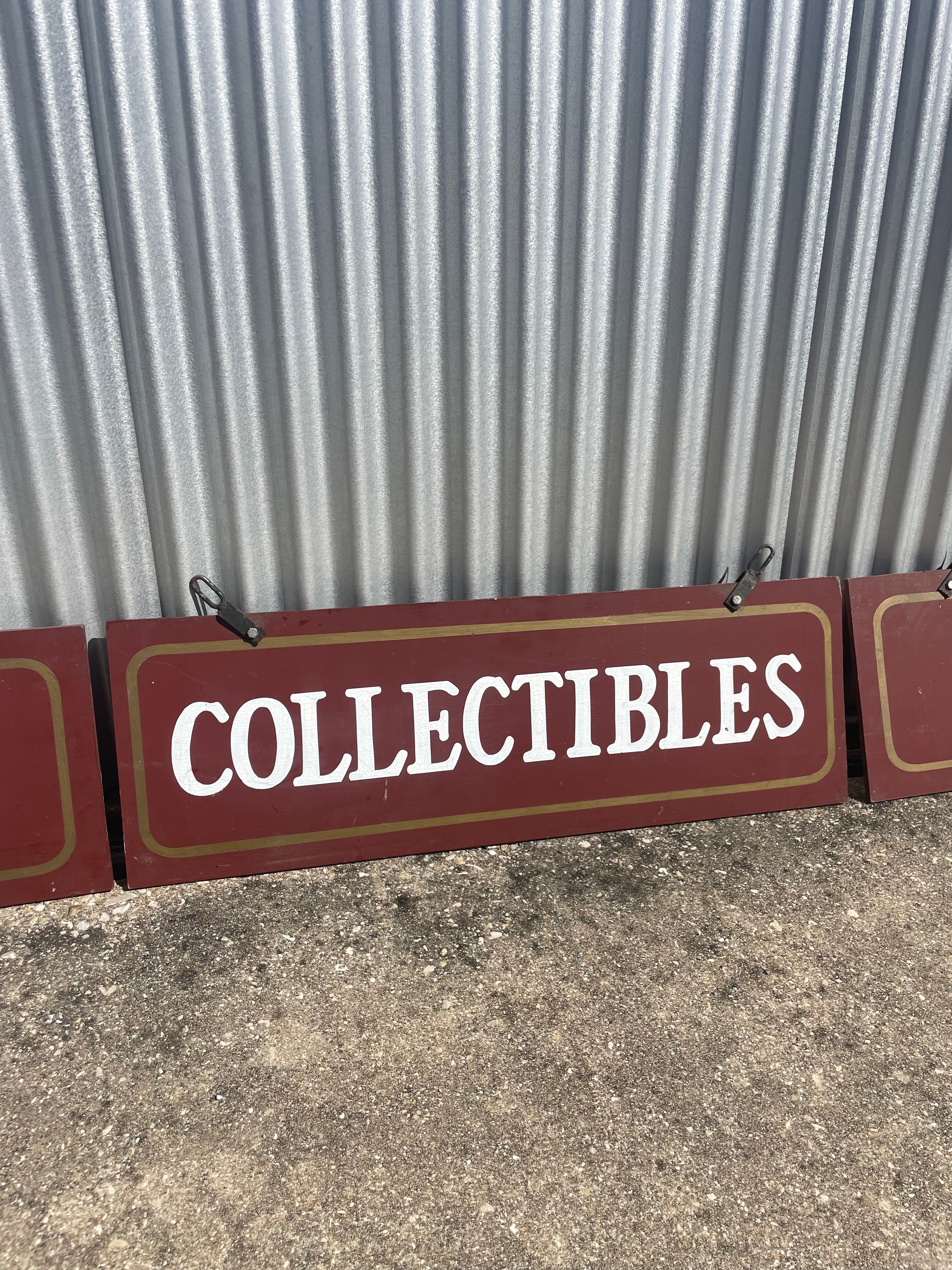 three hand painted signs