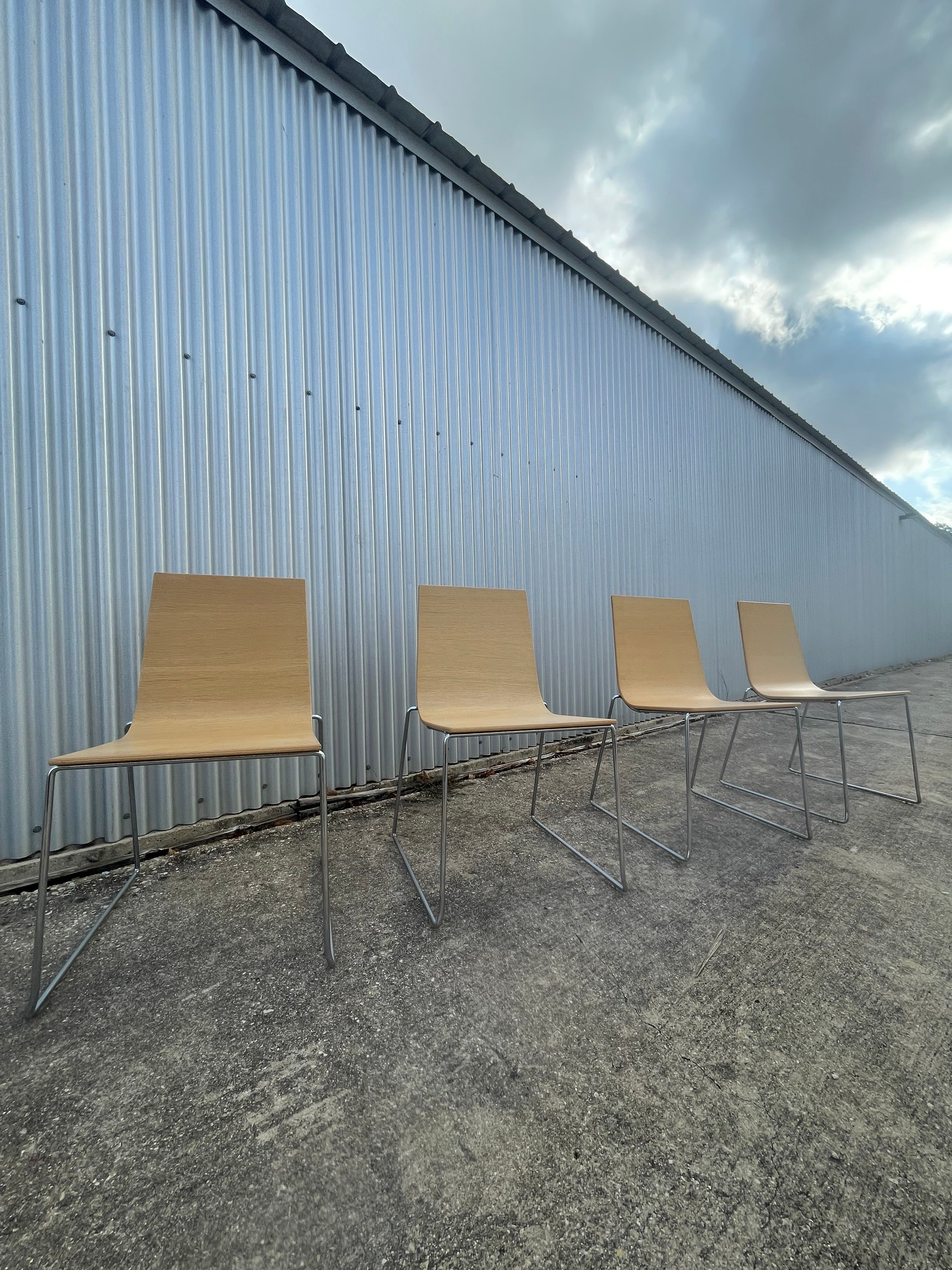 four dining chairs by andreu world