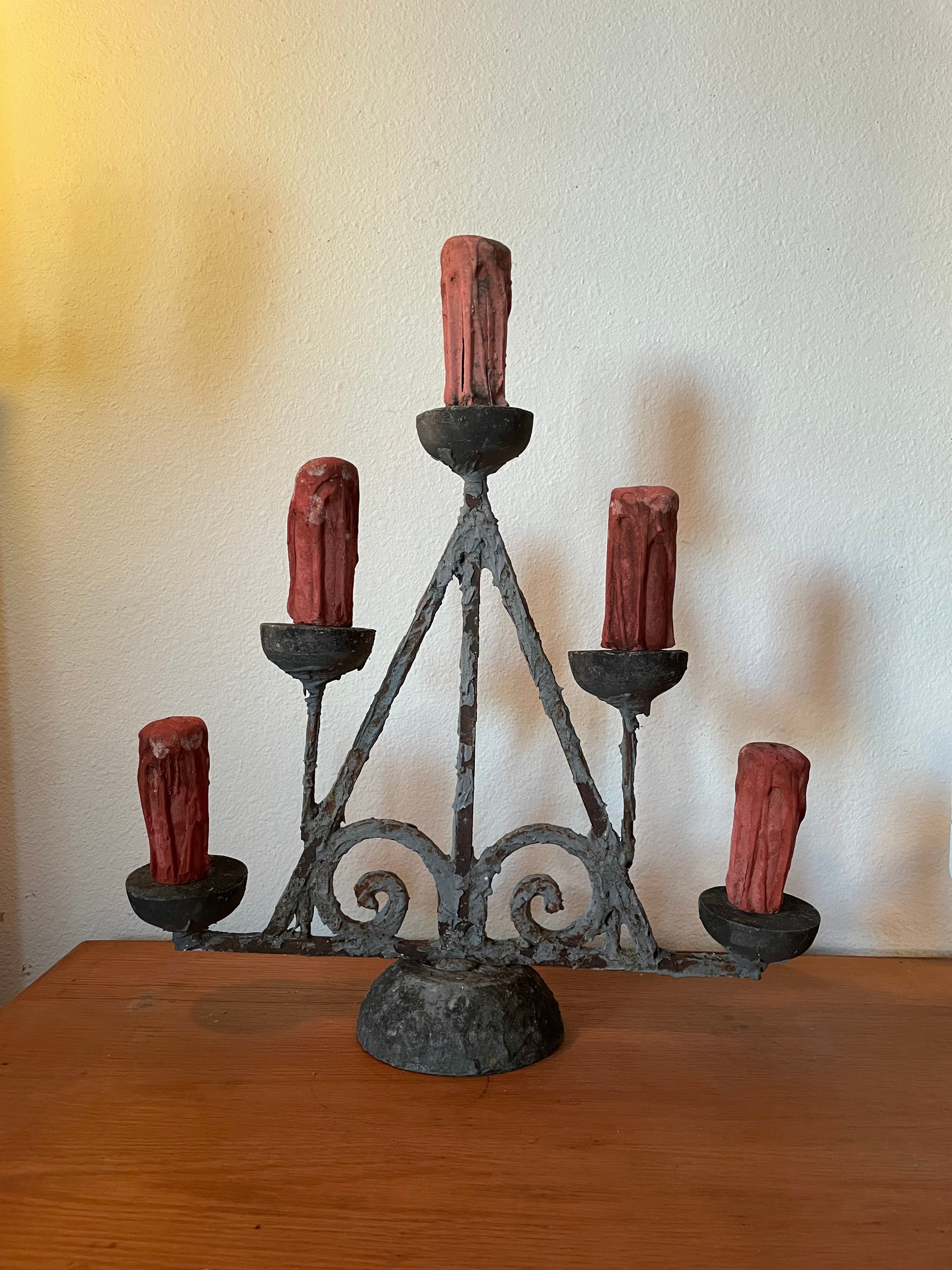 really weird but cool candelabra with five candle figures