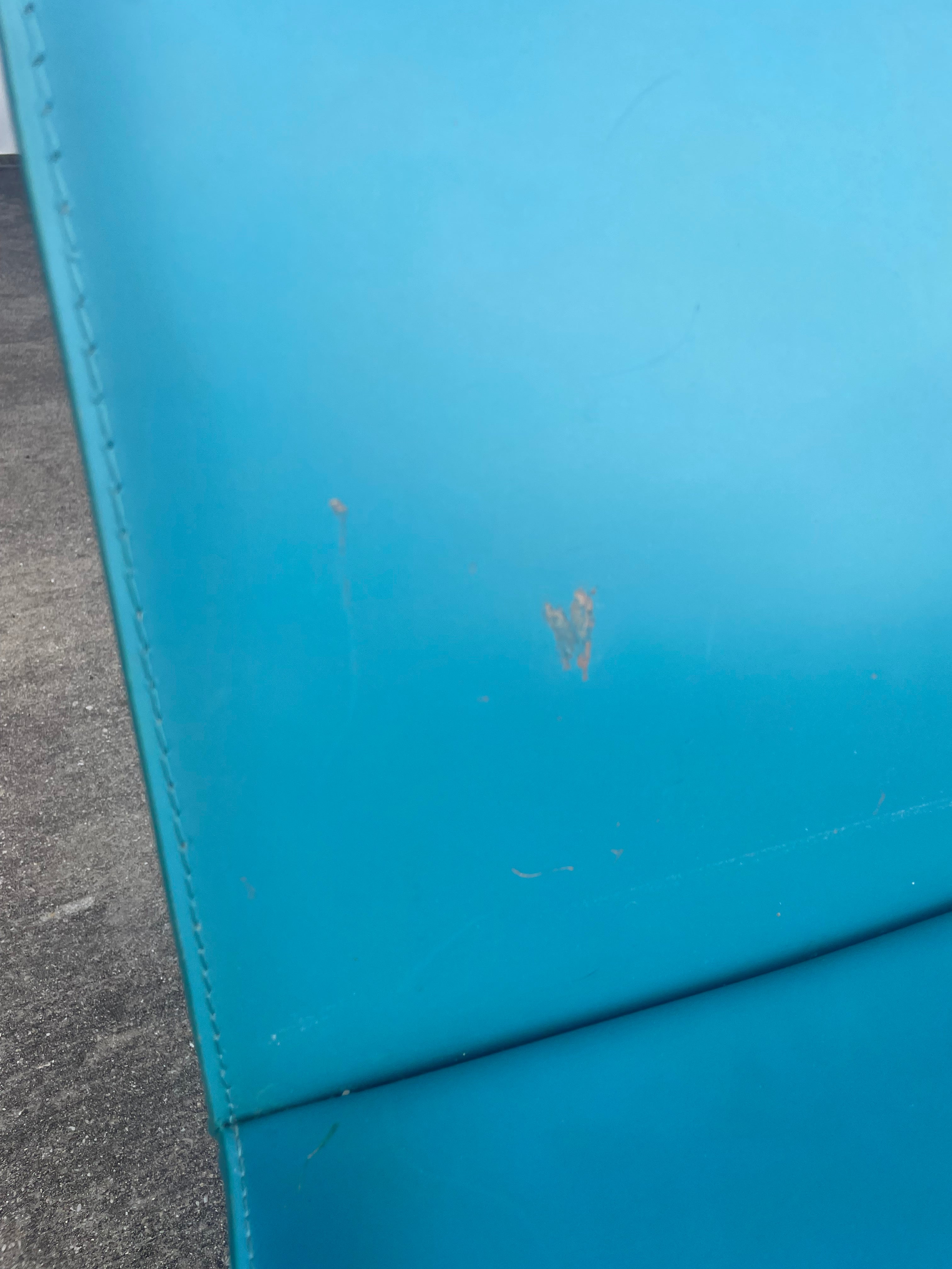 set of four teal leather dining chairs