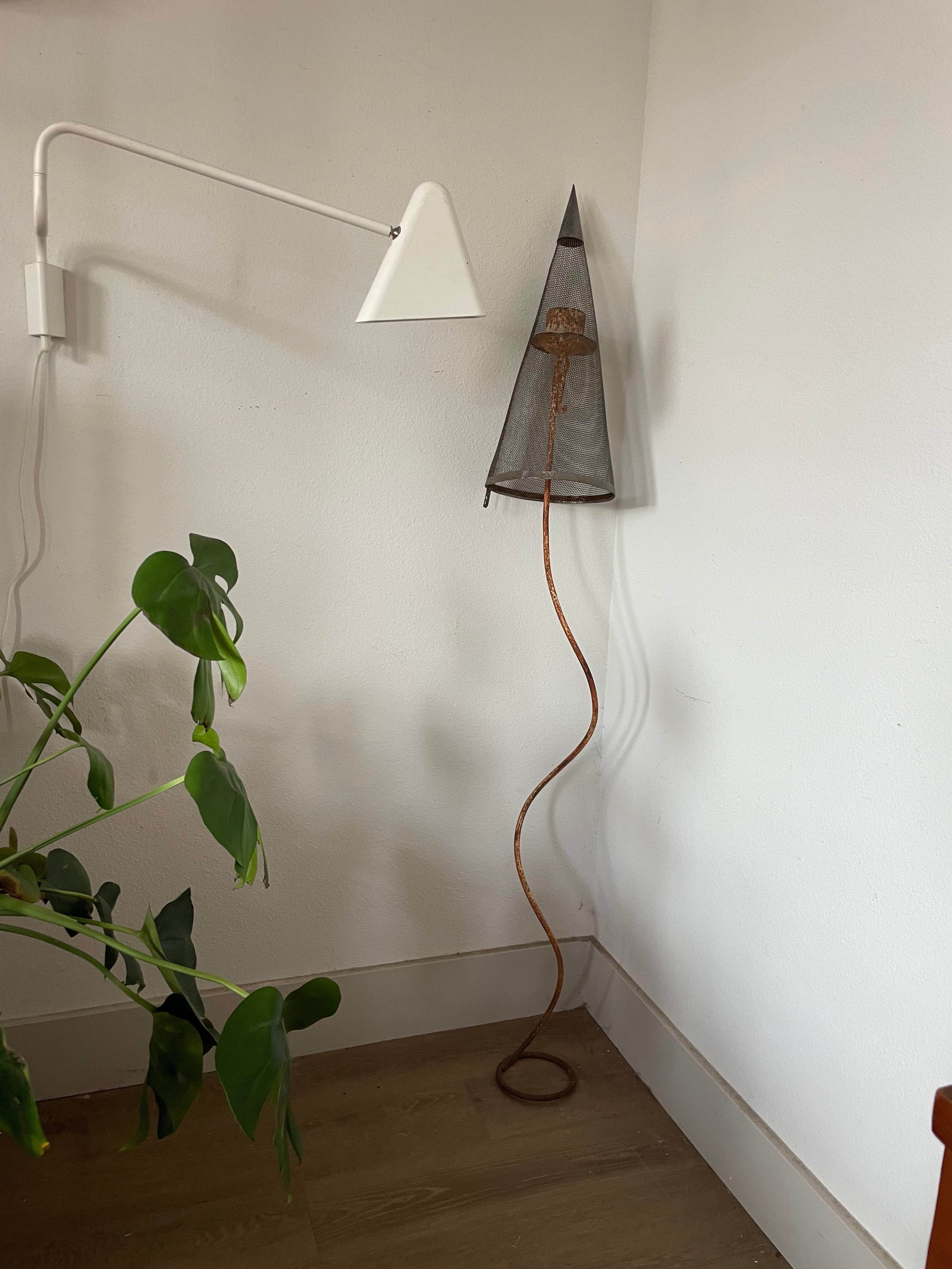 sculpture: iron candlestick and vintage filter