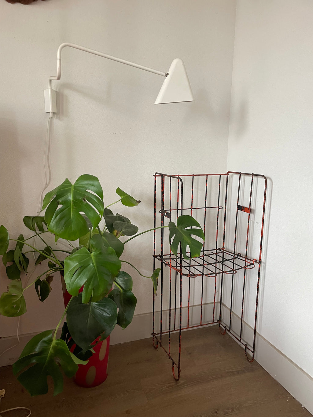 salvage metal magazine rack that is also a chair