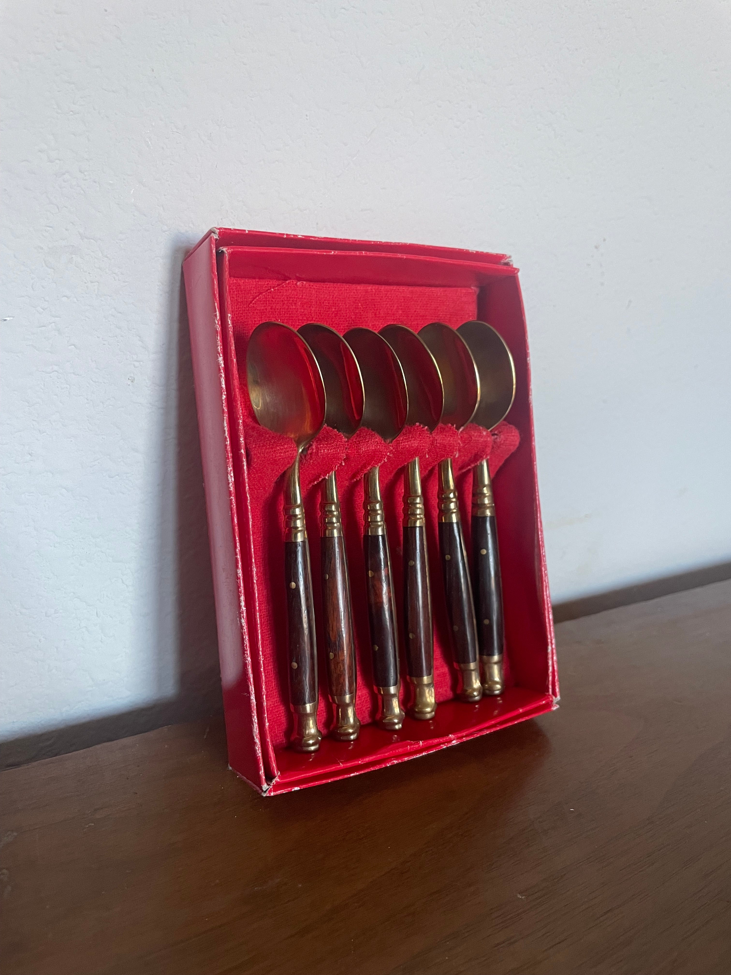 six brass and wooden tea spoons in cheap red box