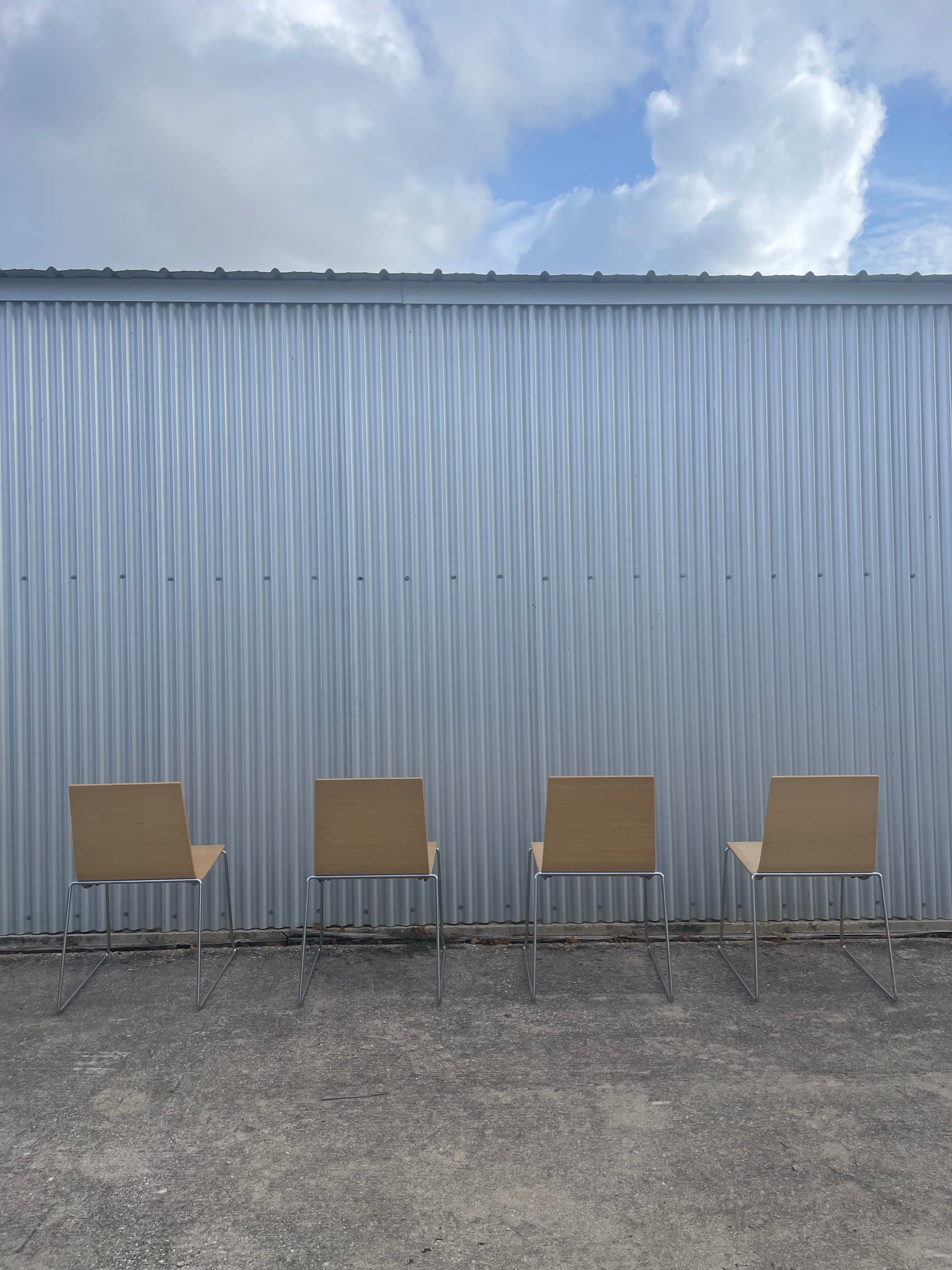 four dining chairs by andreu world