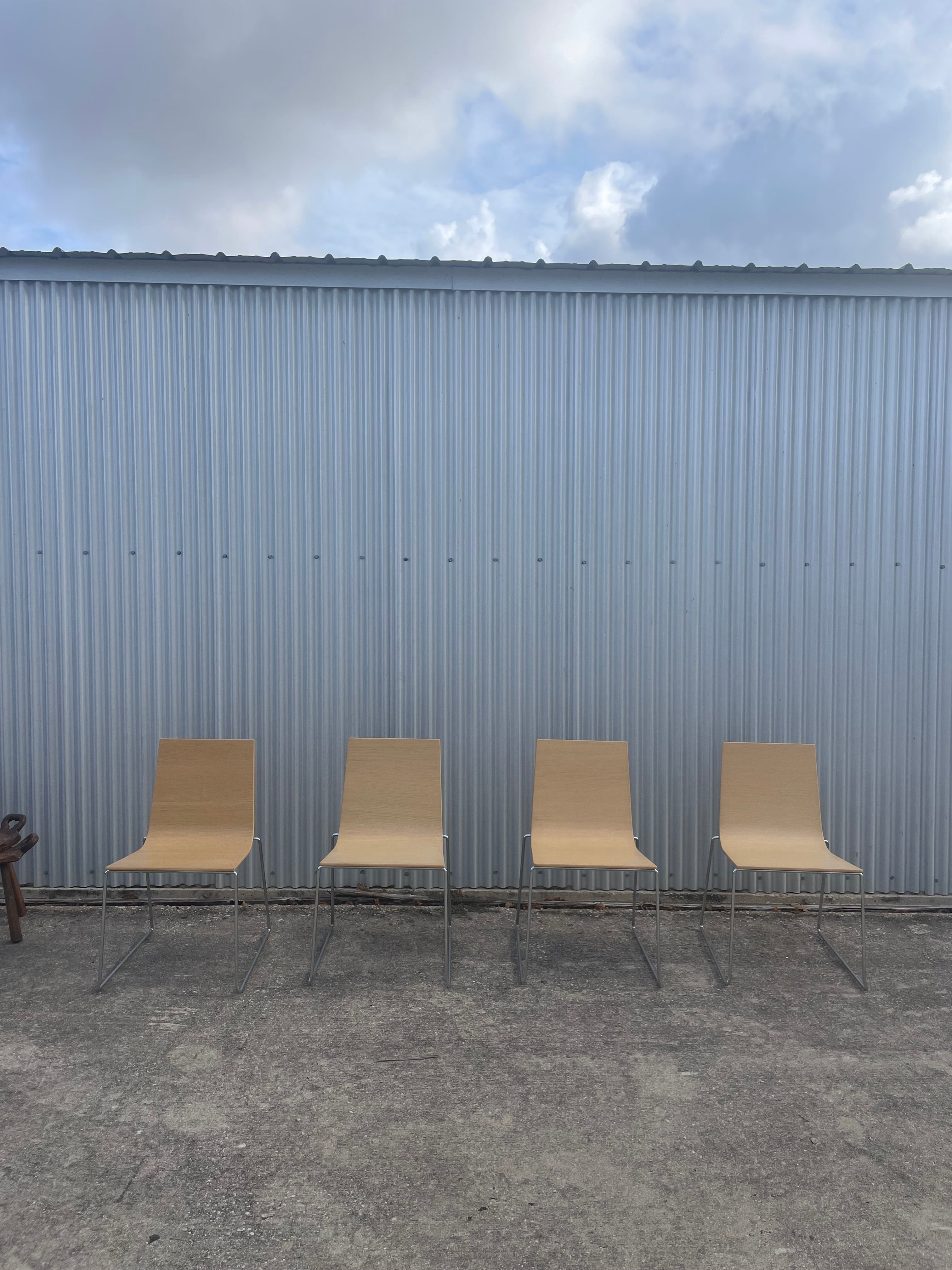 four dining chairs by andreu world