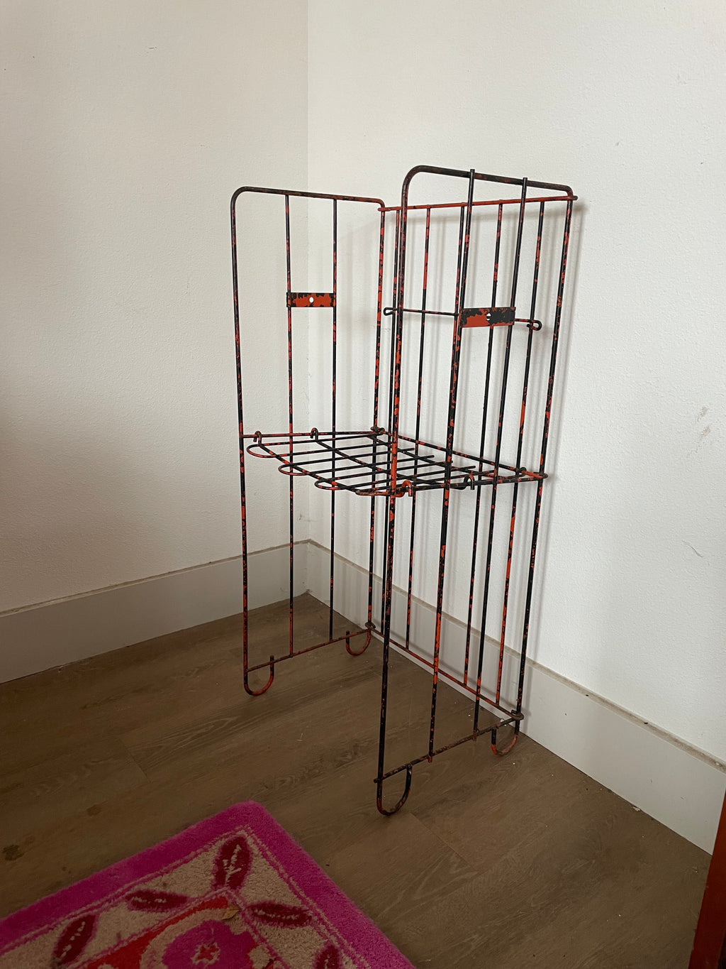 salvage metal magazine rack that is also a chair