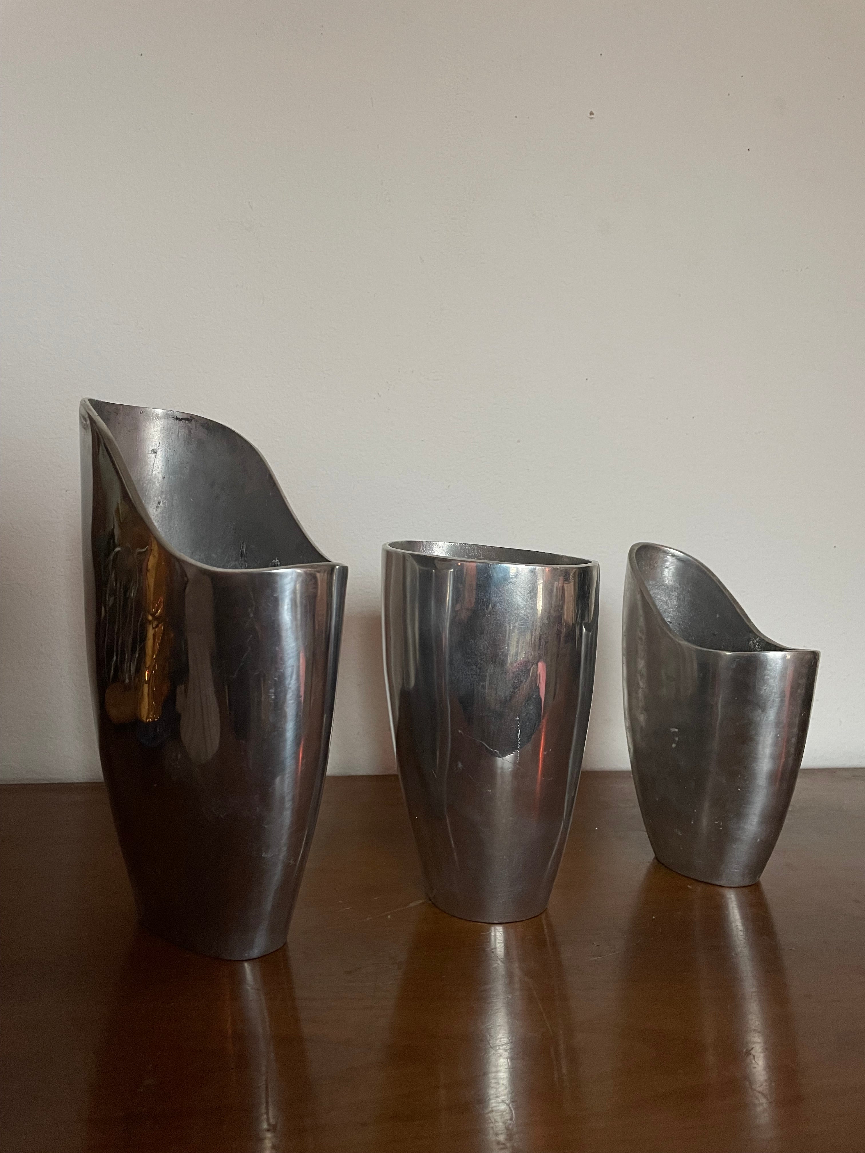 three aluminum vessels