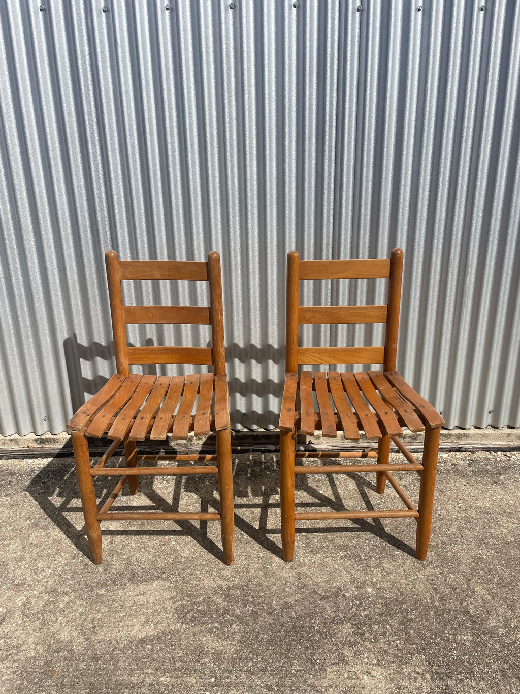 pair of classic farmhouse wooden dining chairs