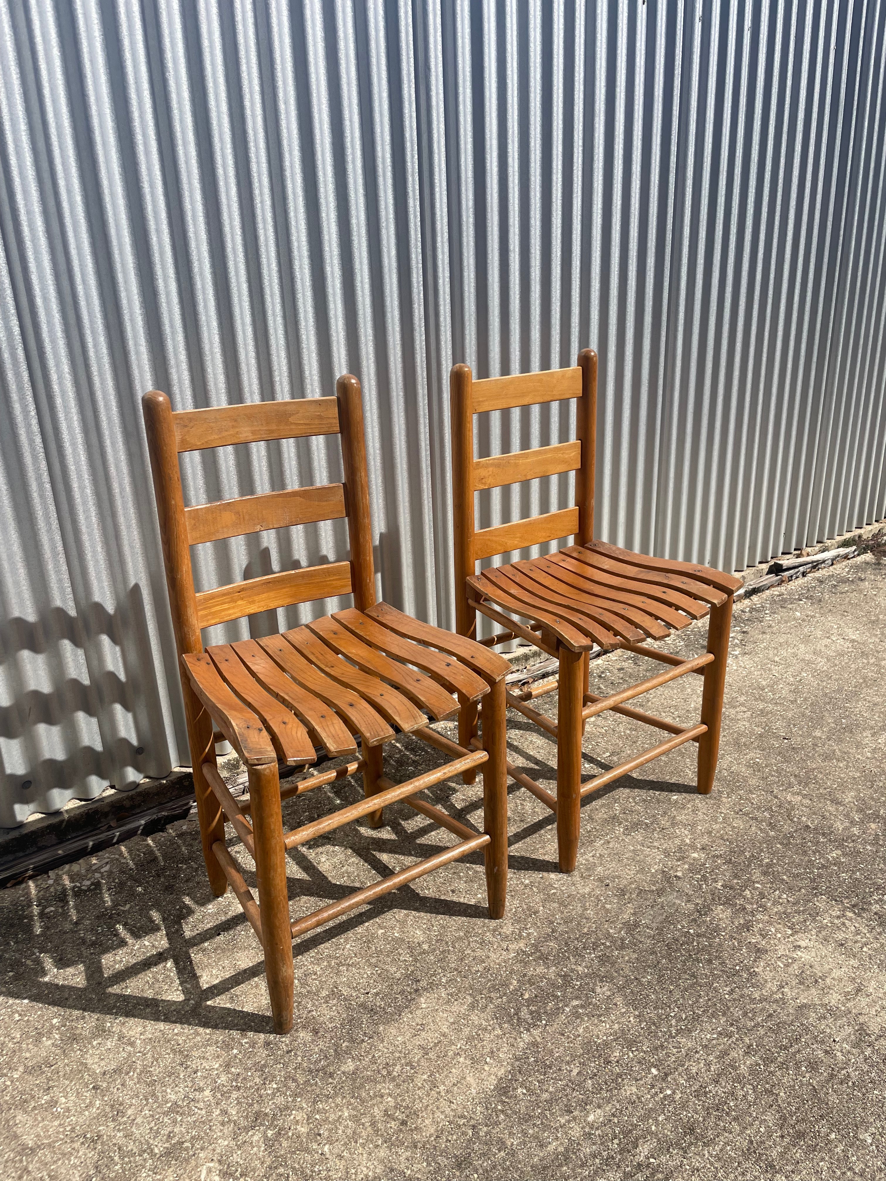 pair of classic farmhouse wooden dining chairs